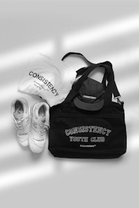 A pair of shoes and a tote bag sitting next to each other