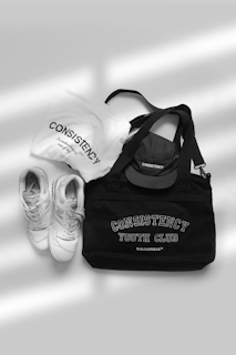 A pair of shoes and a tote bag sitting next to each other