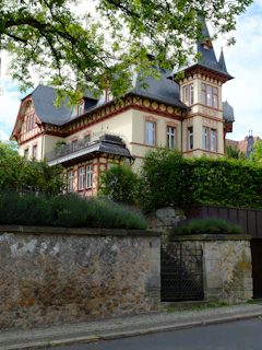 A large house sitting on the side of a road