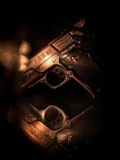 A close up of a gun on a table