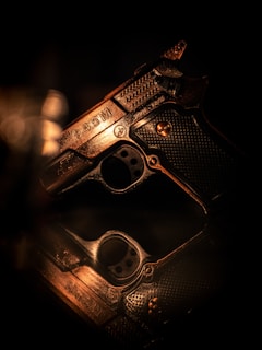 A close up of a gun on a table