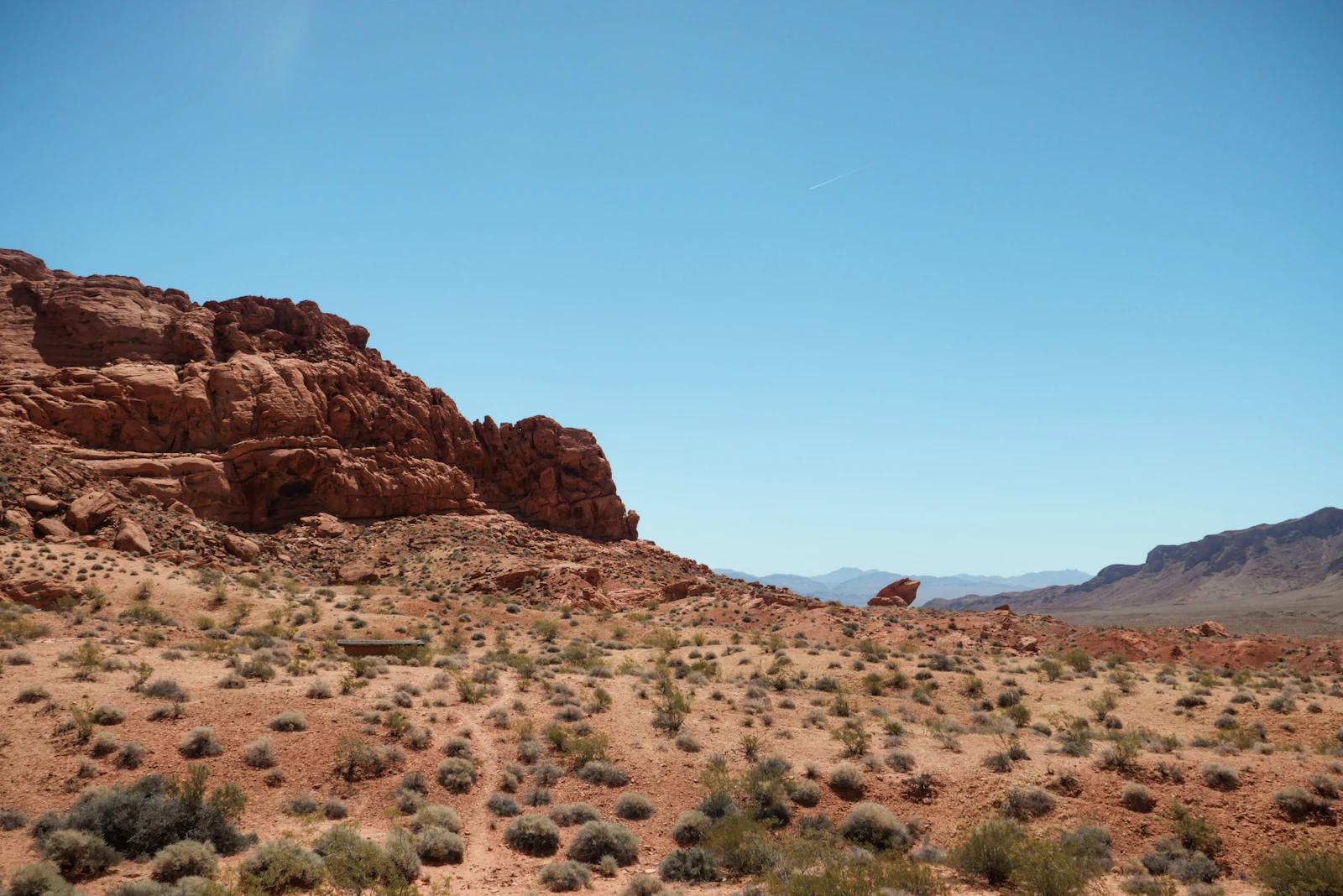 A desert valley with mountains on the horizon.