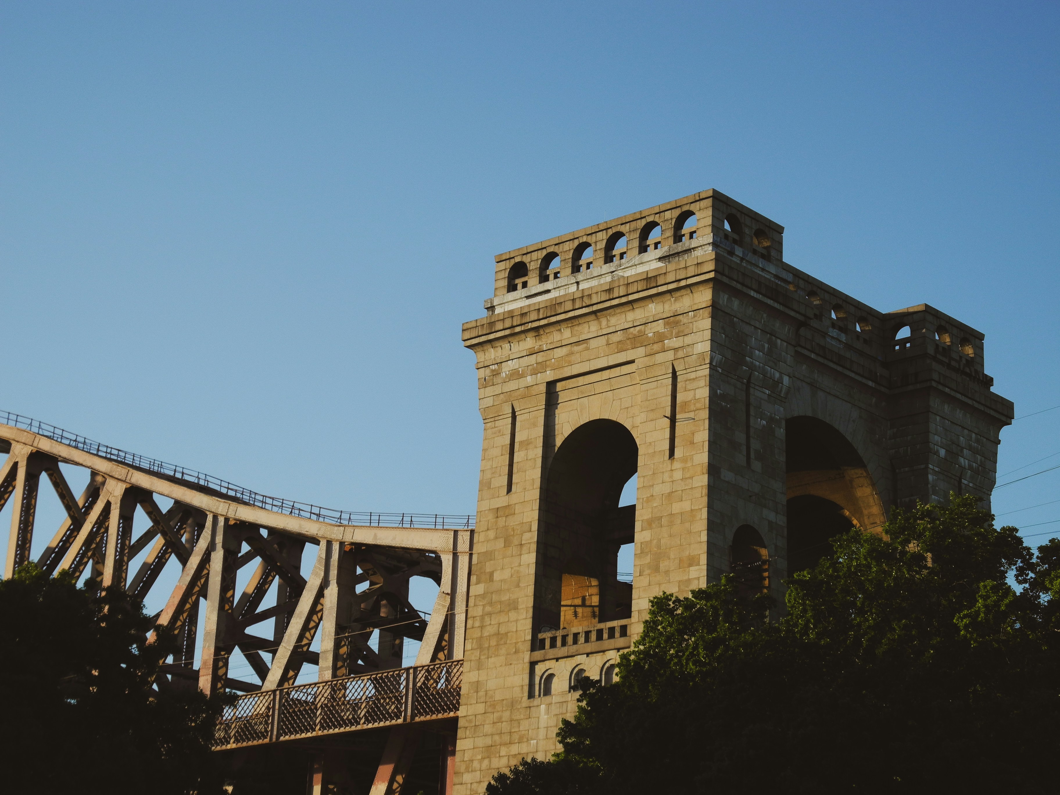 A bridge with a clock tower on top of it
