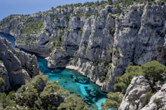 A river flowing through a canyon surrounded by rocks