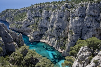 A river flowing through a canyon surrounded by rocks