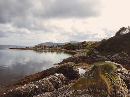 A large body of water surrounded by rocks