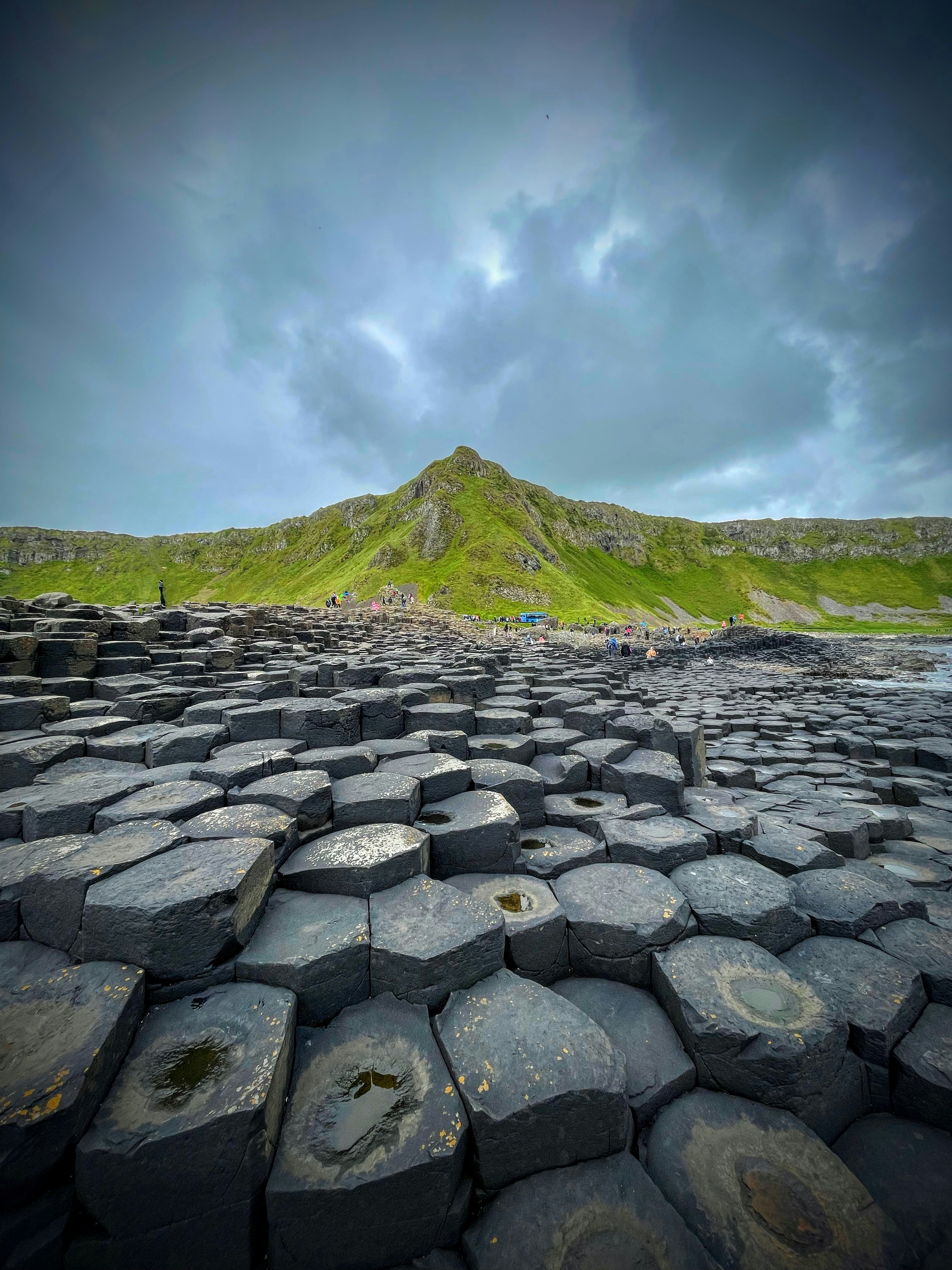 A large rock formation in the middle of a field photo – Free Human ...