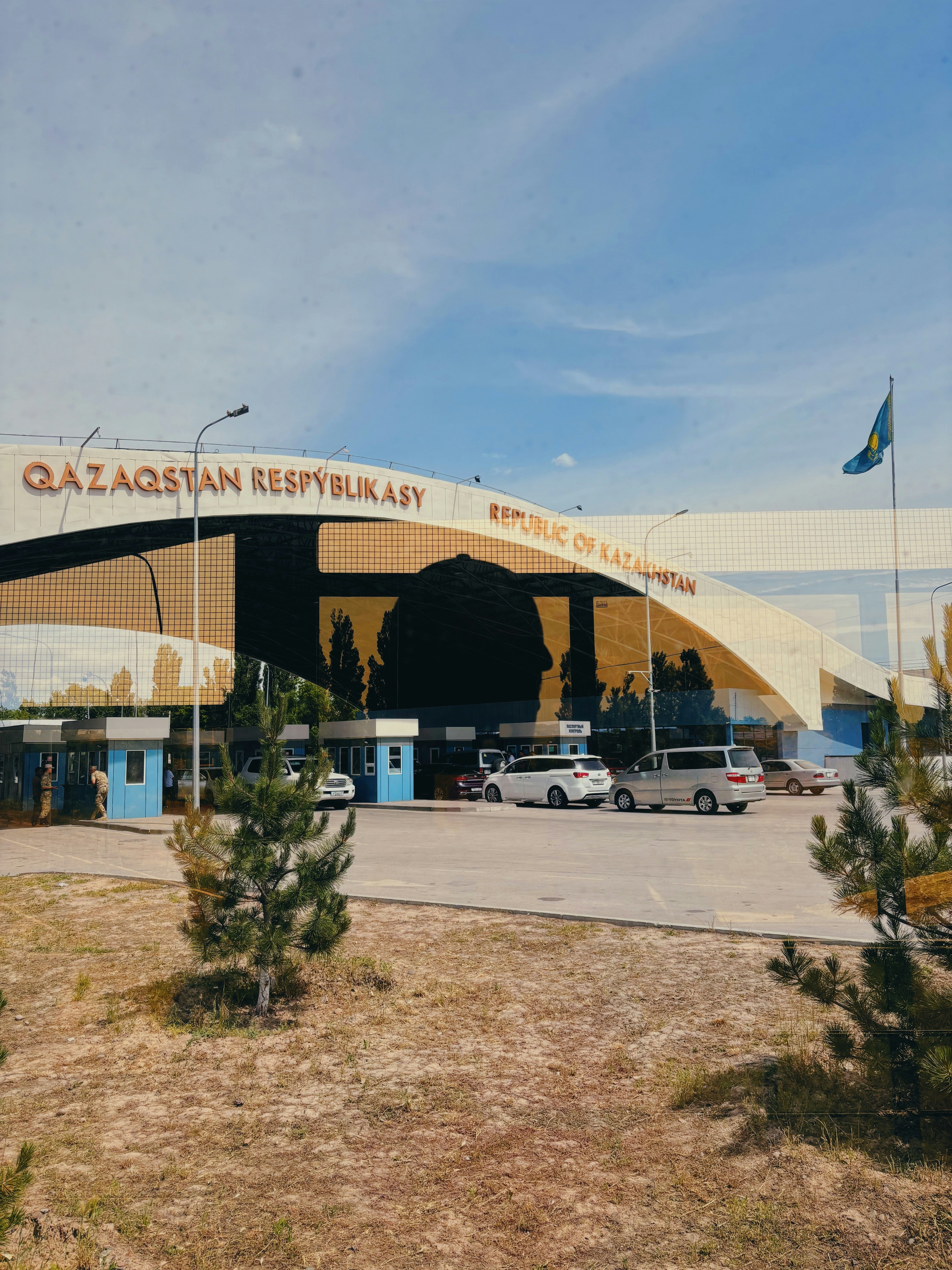 A large building with cars parked in front of it