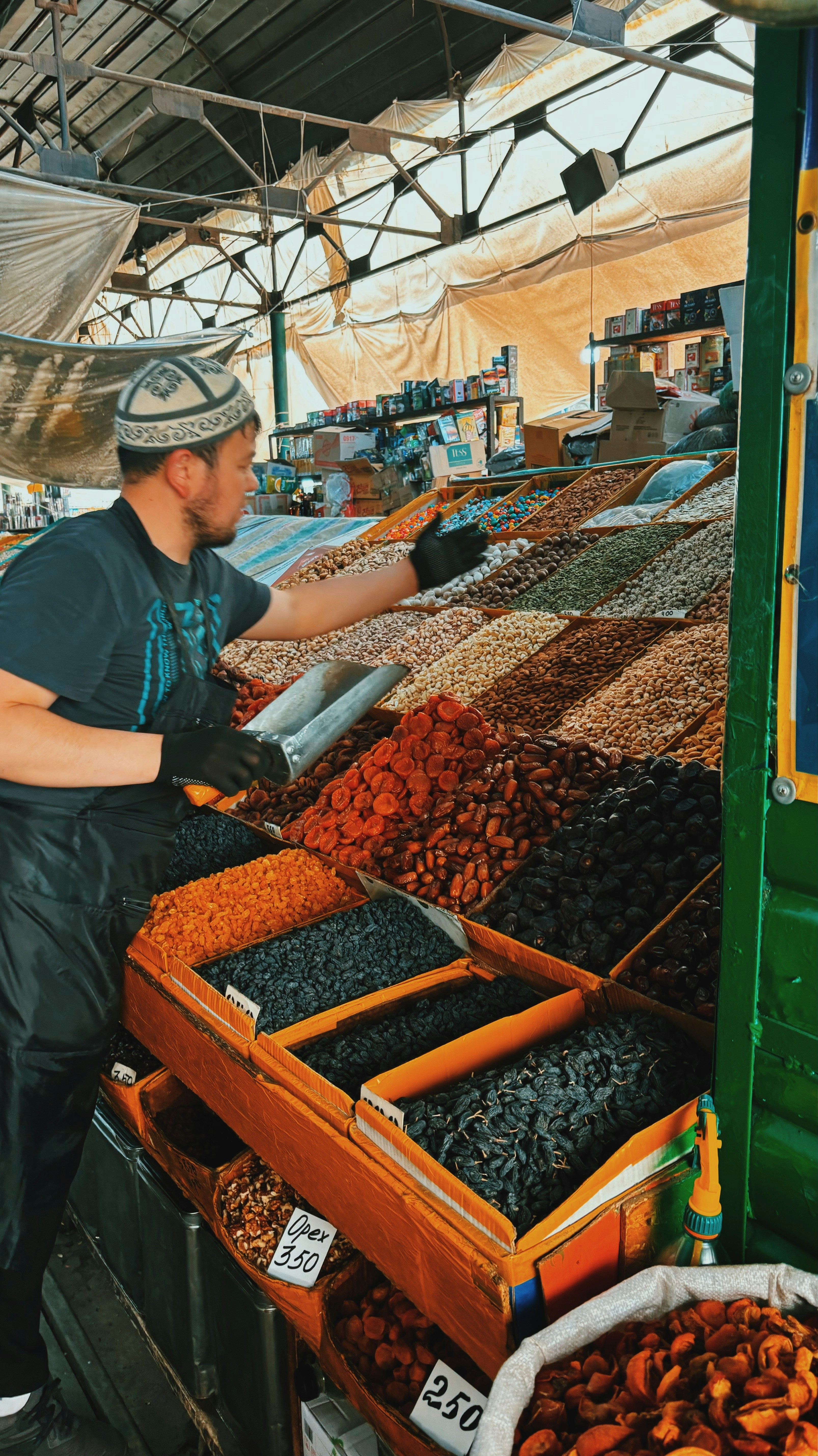 A man standing in front of a table filled with lots of food