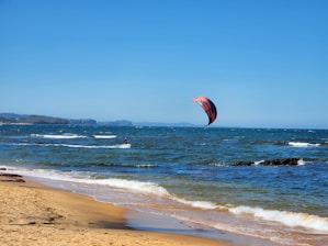 A person para sailing on the ocean on a sunny day