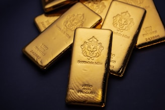 A pile of gold bars sitting on top of a table