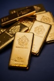 A pile of gold bars sitting on top of a table