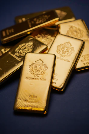 A pile of gold bars sitting on top of a table