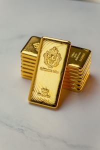 A stack of gold bars sitting on top of a table