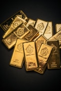 A pile of gold bars sitting on top of a table