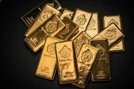 A pile of gold bars sitting on top of a table