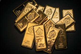 A pile of gold bars sitting on top of a table