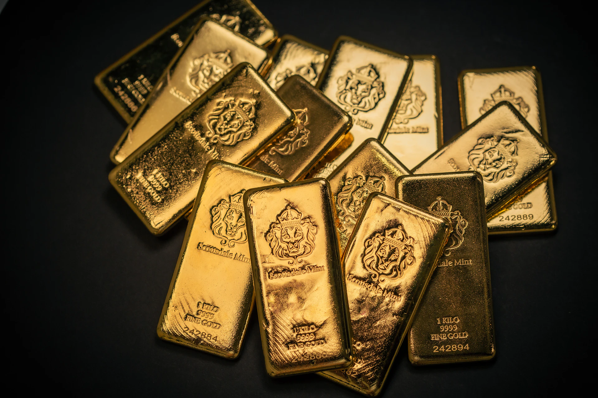 A pile of gold bars sitting on top of a table
