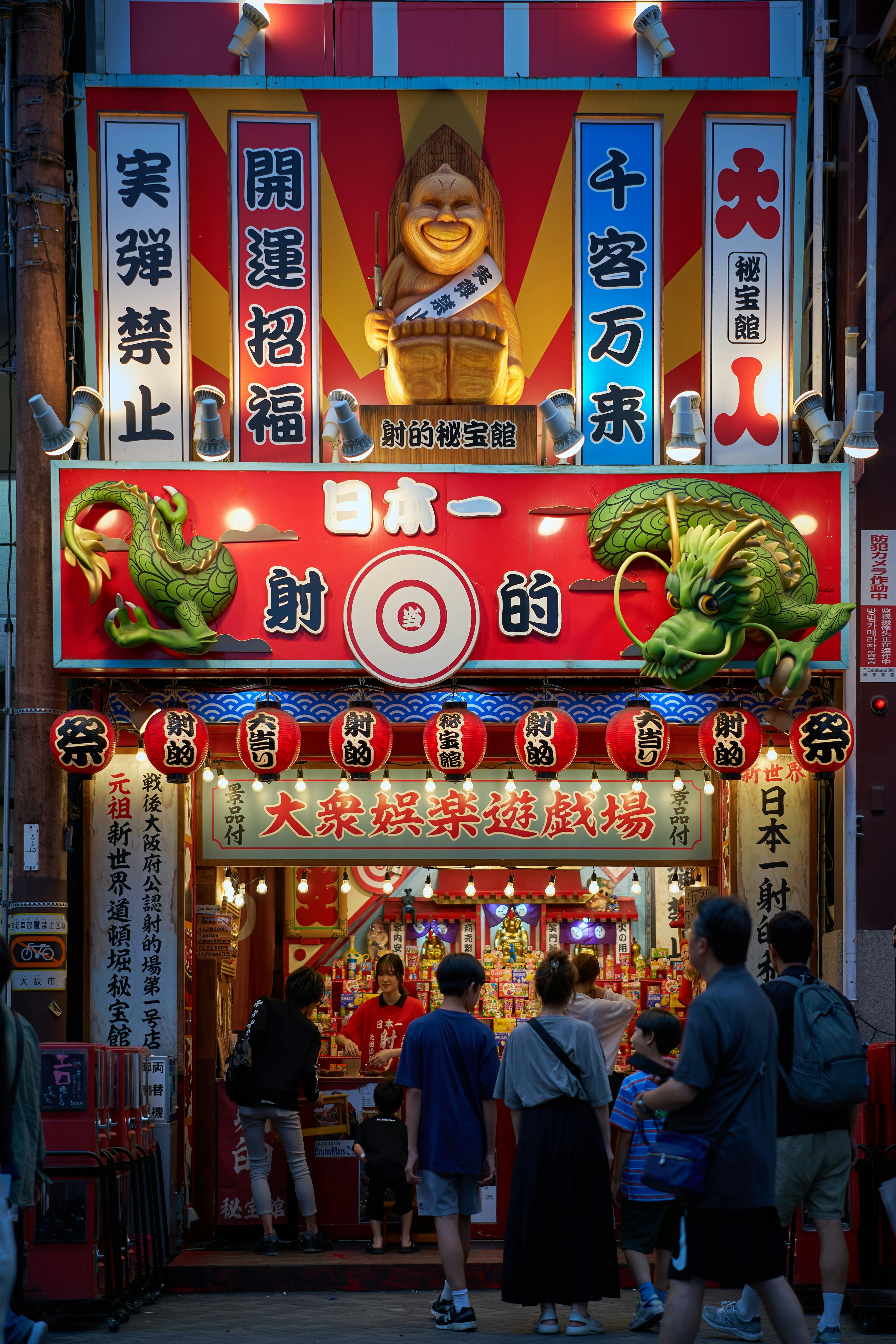 A group of people standing in front of a store