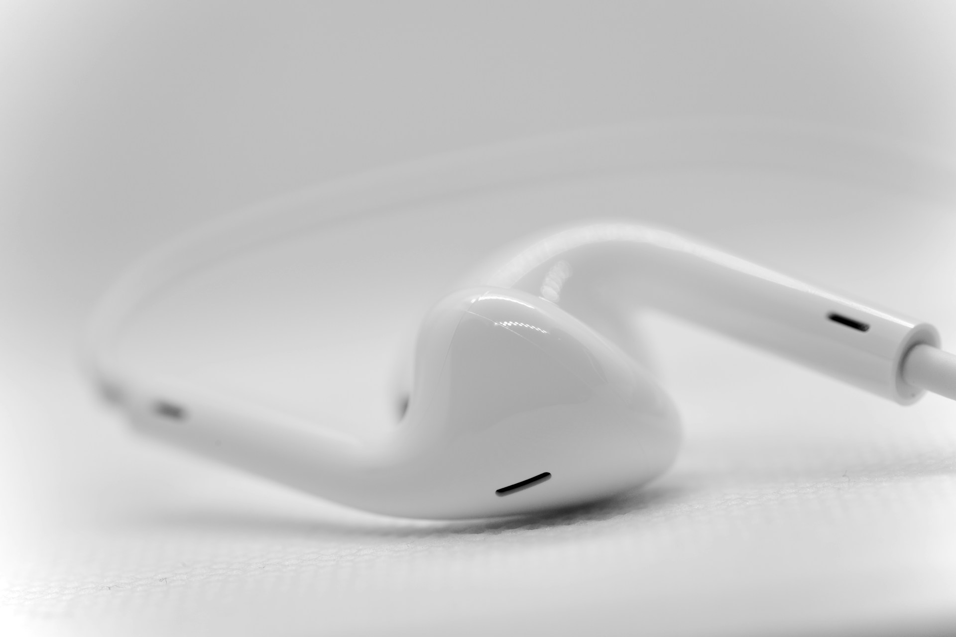 A pair of ear buds sitting on top of a table