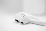 A pair of ear buds sitting on top of a table