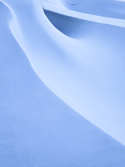 A person skiing down a snow covered slope