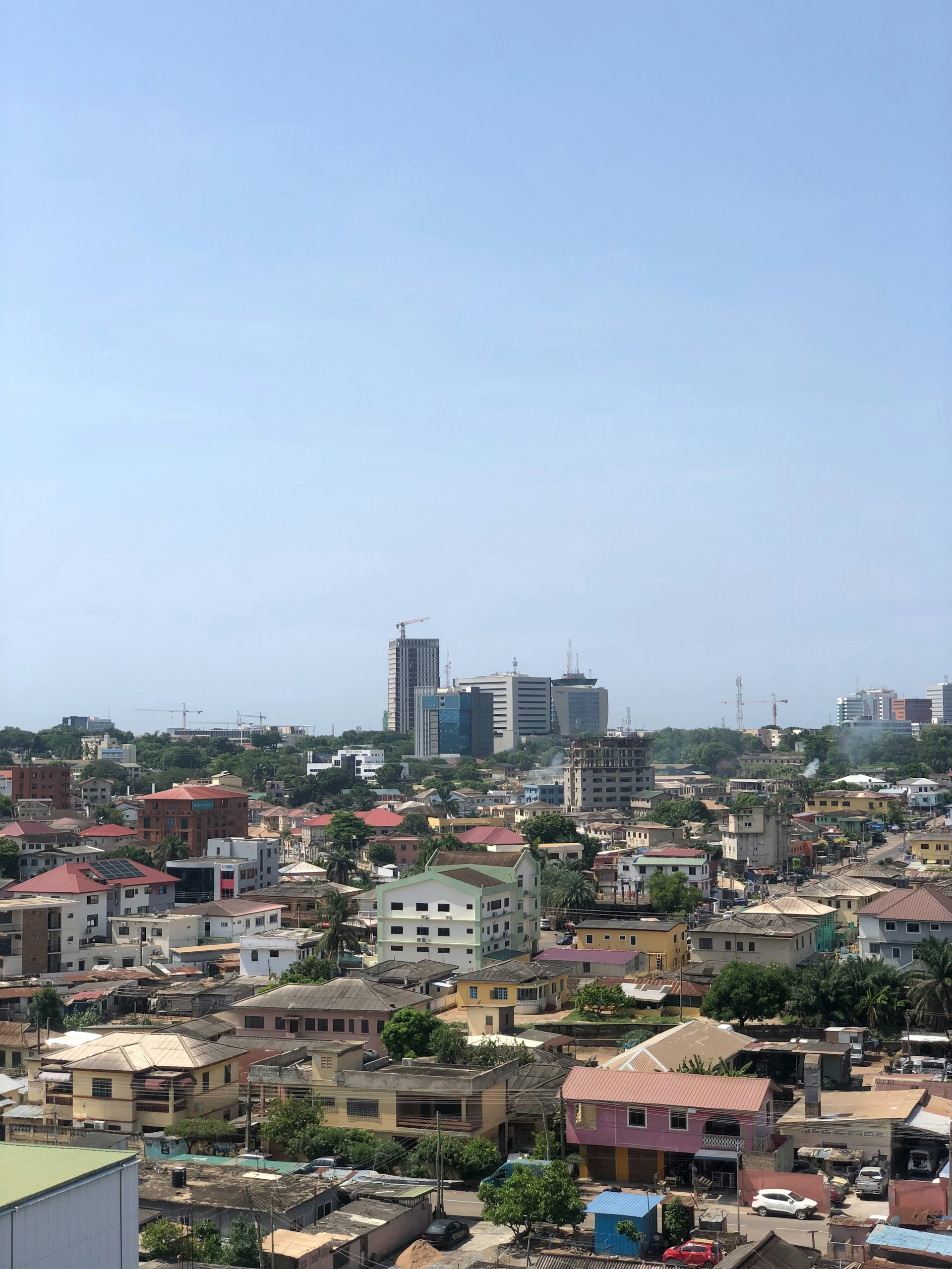 A view of a city from the top of a building