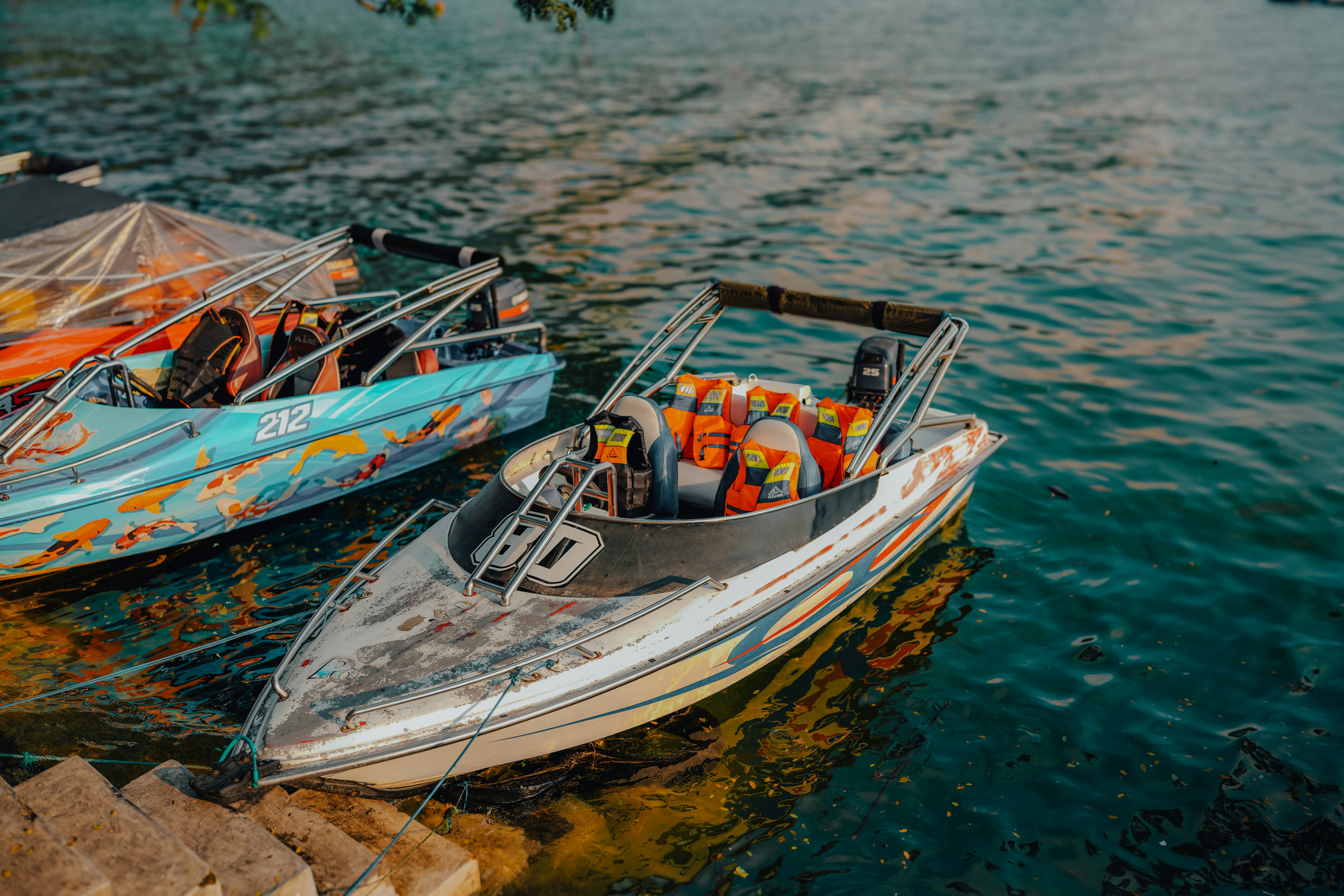 A couple of boats that are sitting in the water