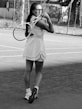 A woman holding a tennis racquet on a tennis court