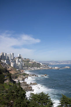 A scenic view of a city and the ocean