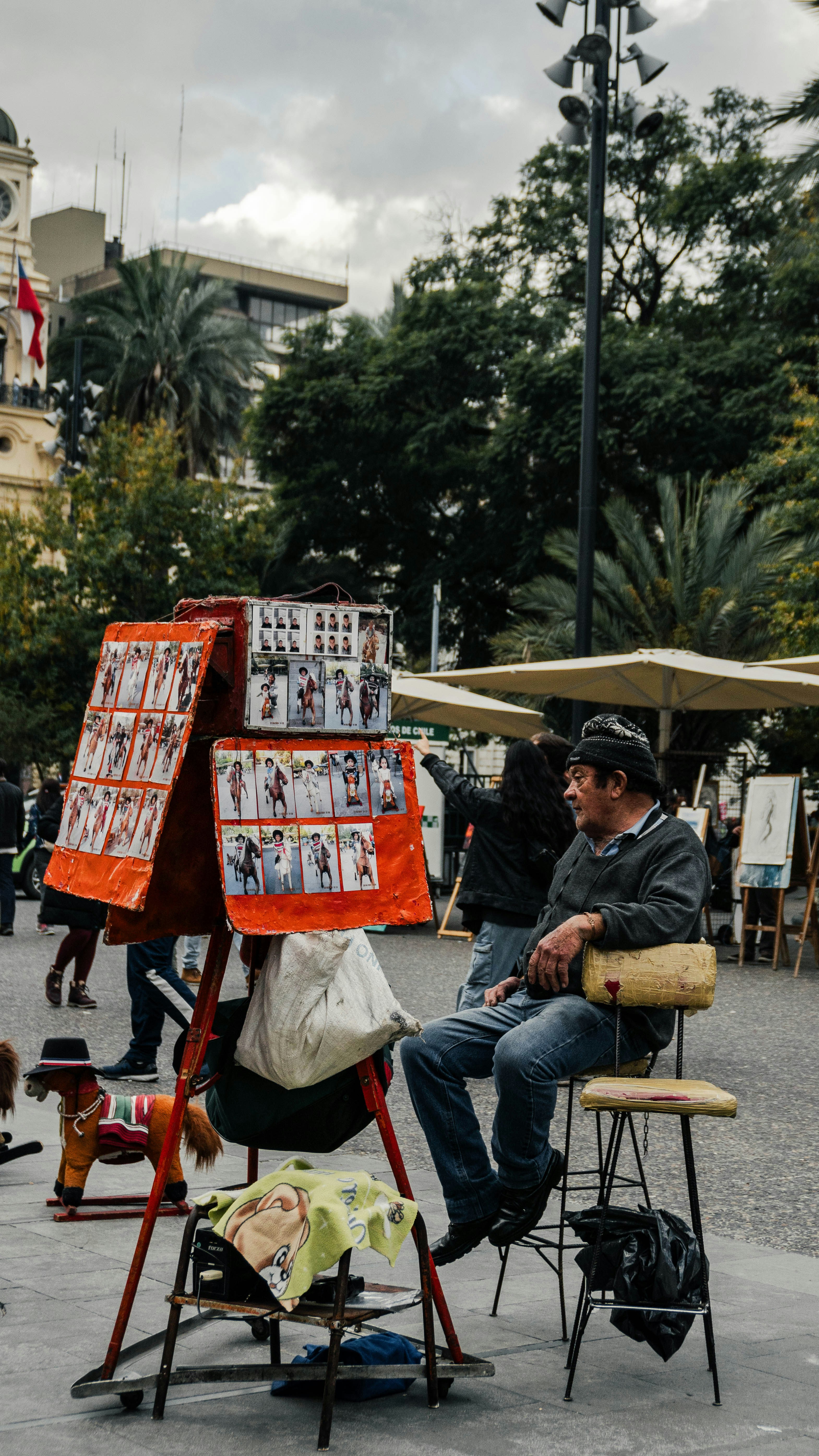 A man sitting on a chair in front of an easel