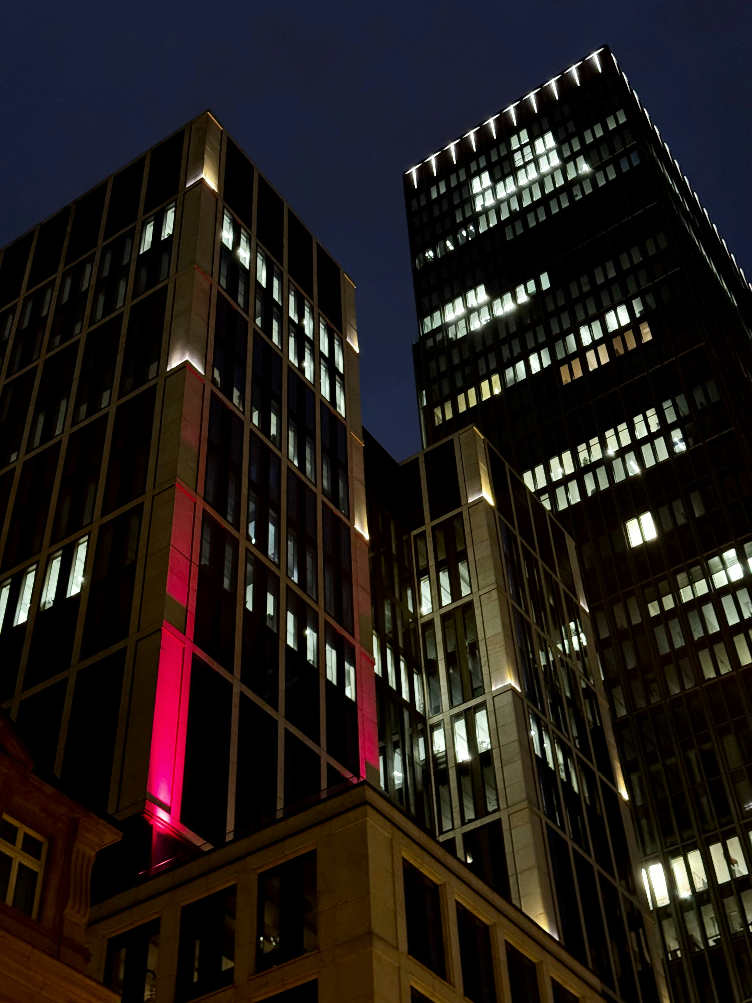 A couple of tall buildings sitting next to each other