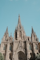 A large cathedral with a clock on the front of it