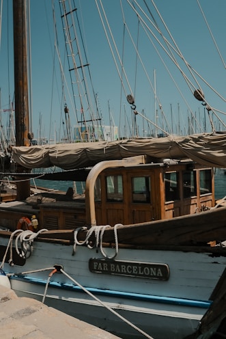 A blue and white boat docked in a harbor