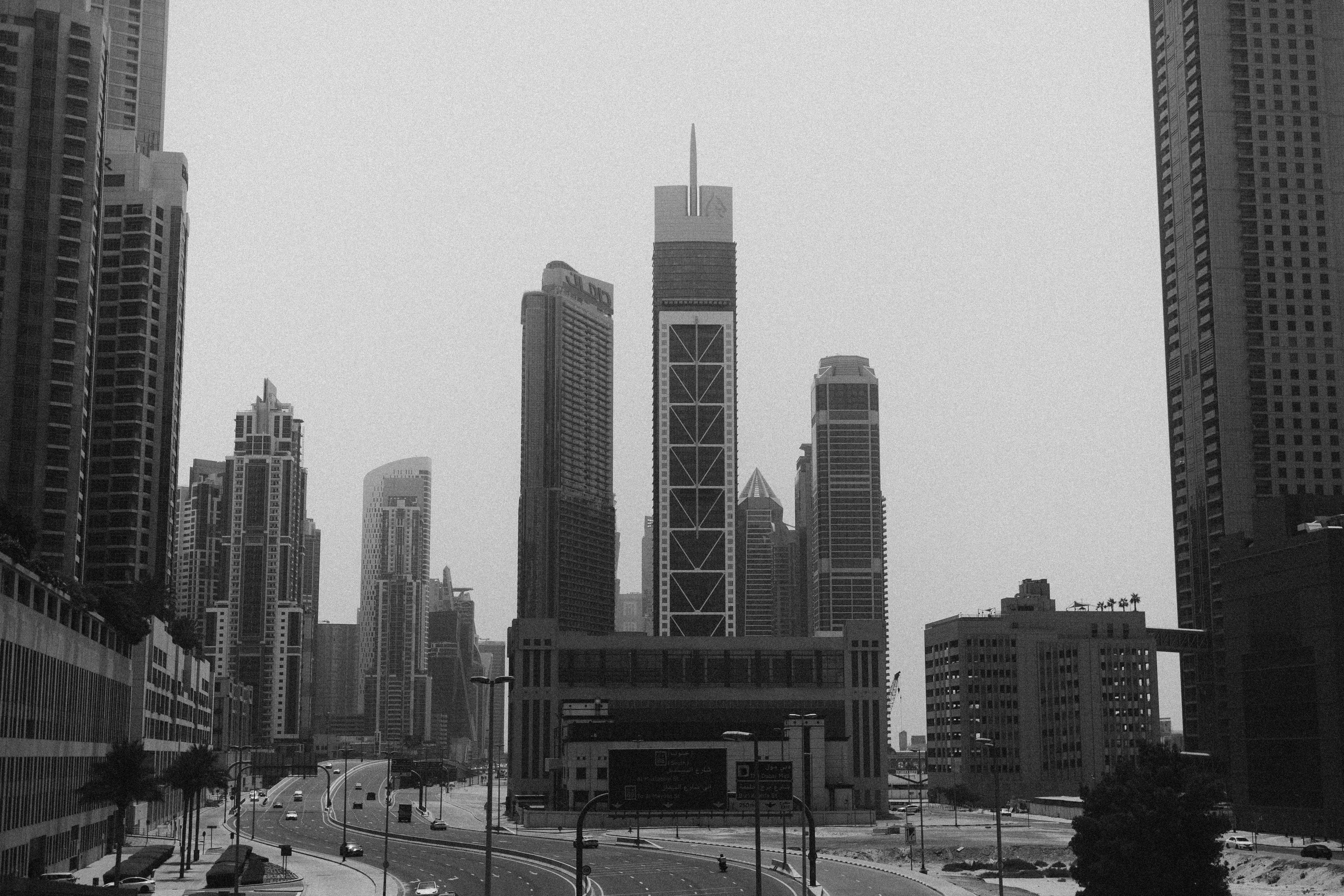 A black and white photo of a city street