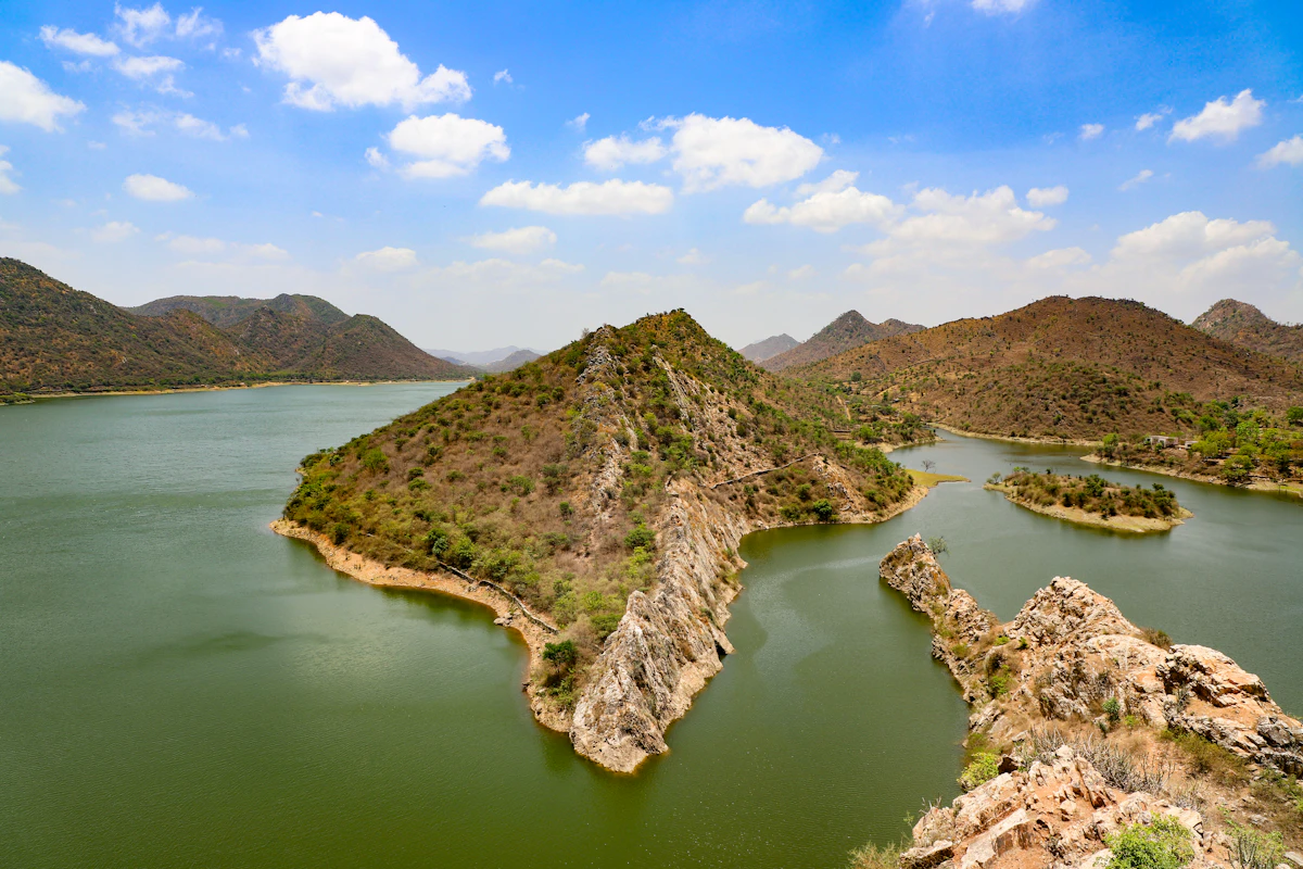A lake surrounded by hills in soft light