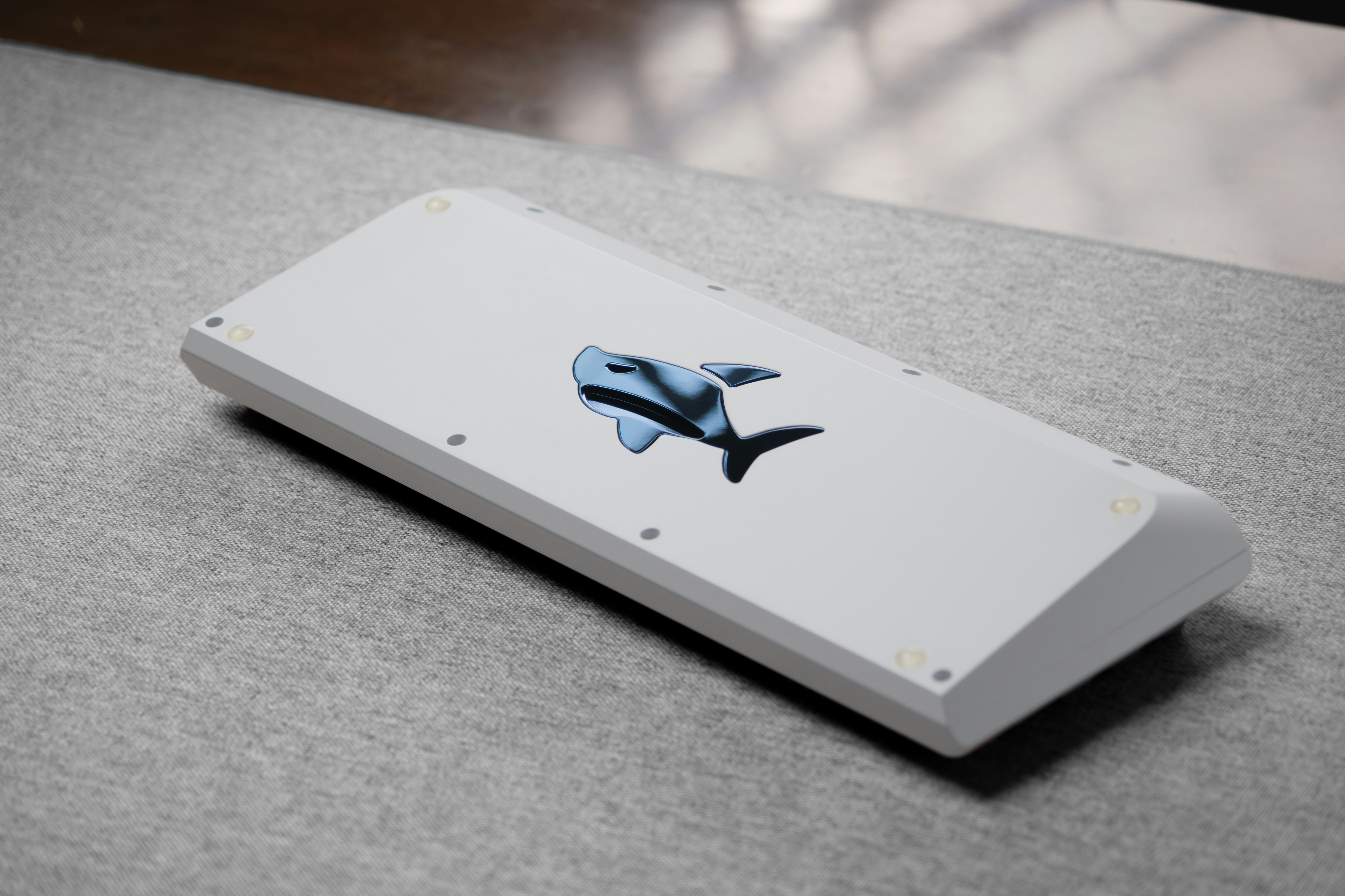 A close up of an apple product on a table