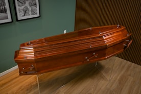 A wooden boat sitting on top of a wooden floor