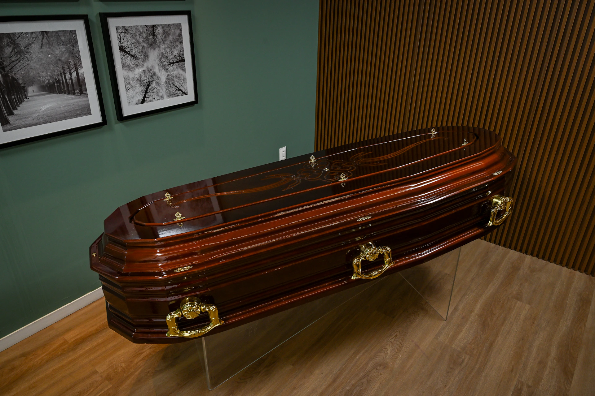 A large wooden trunk sitting on top of a hard wood floor