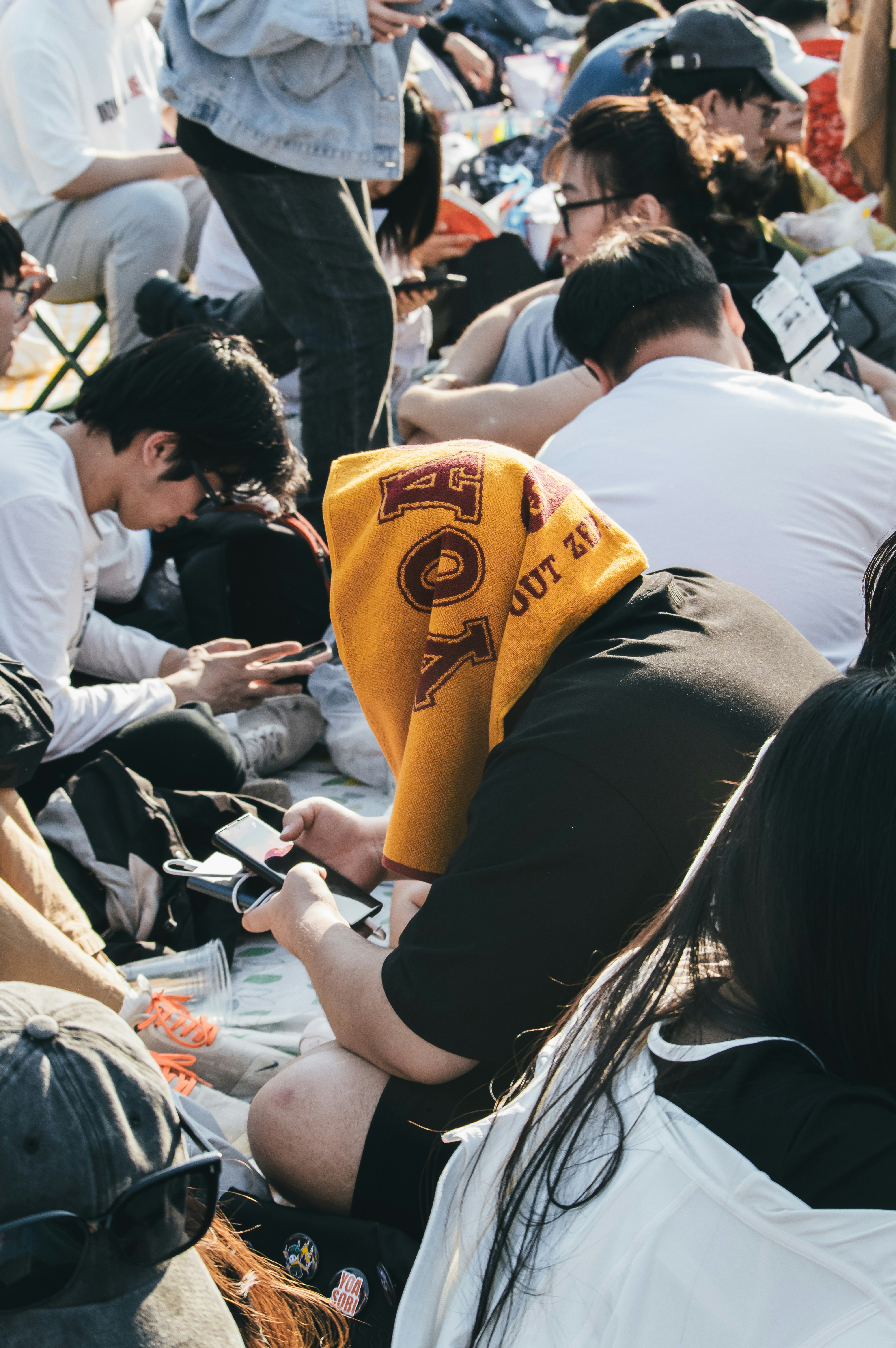 A group of people sitting next to each other