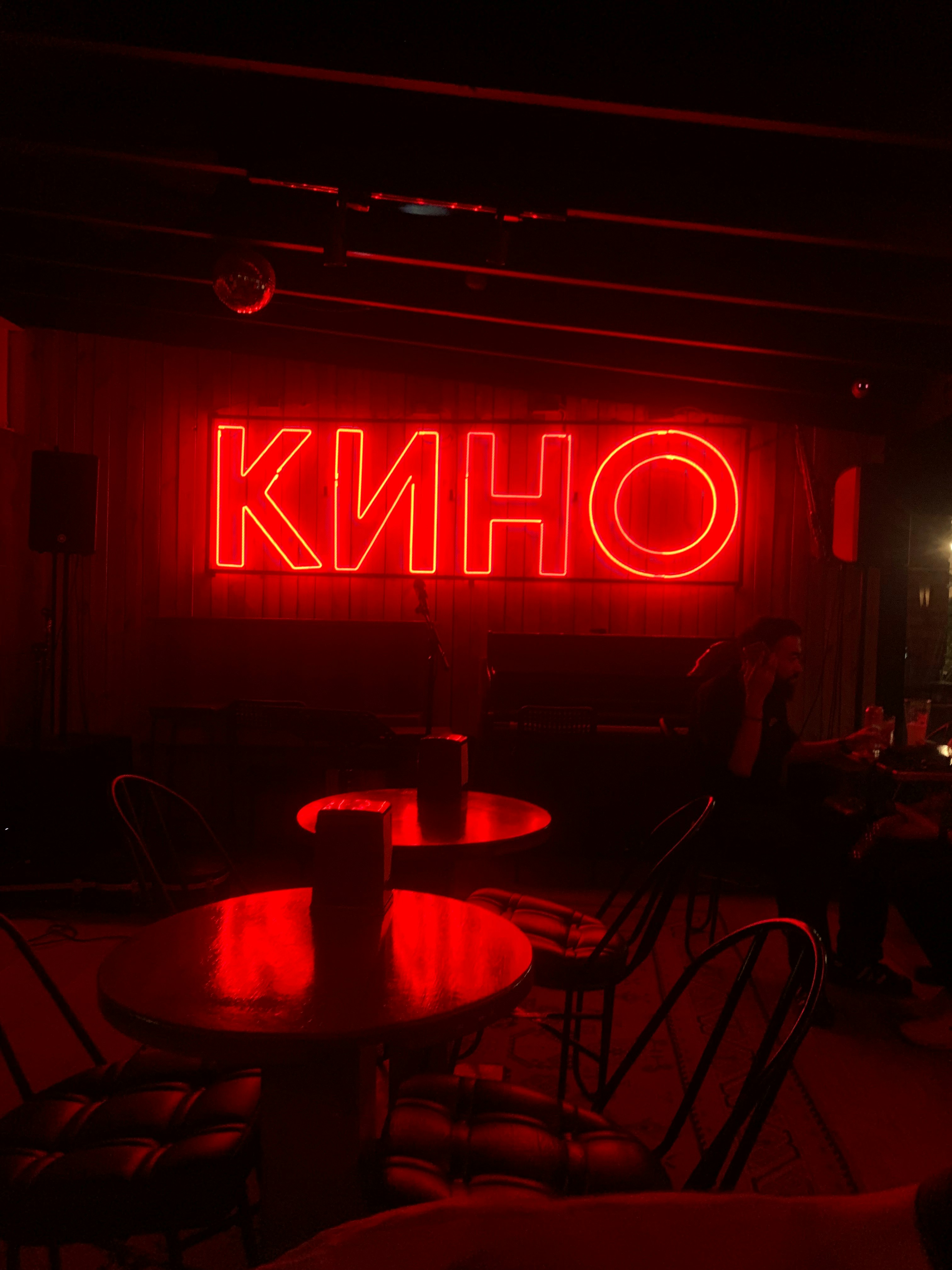 A restaurant with a neon sign that says ohnk