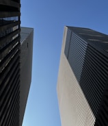 A couple of tall buildings next to each other