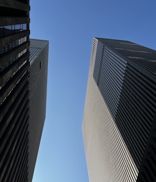A couple of tall buildings next to each other