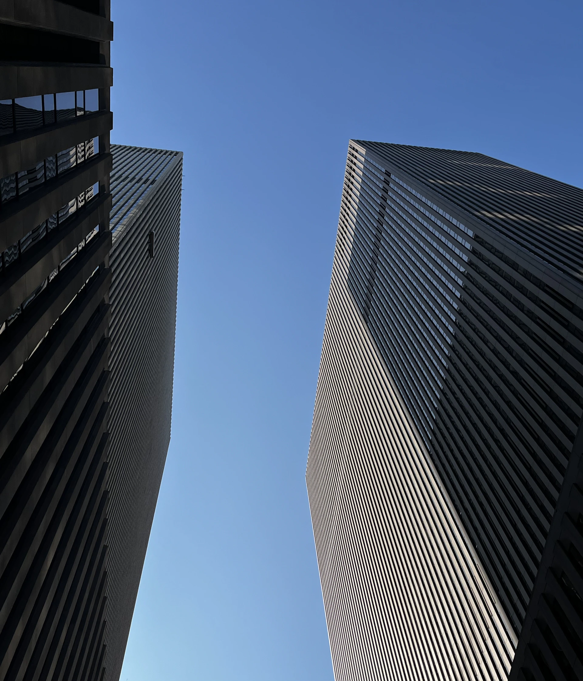 A couple of tall buildings next to each other