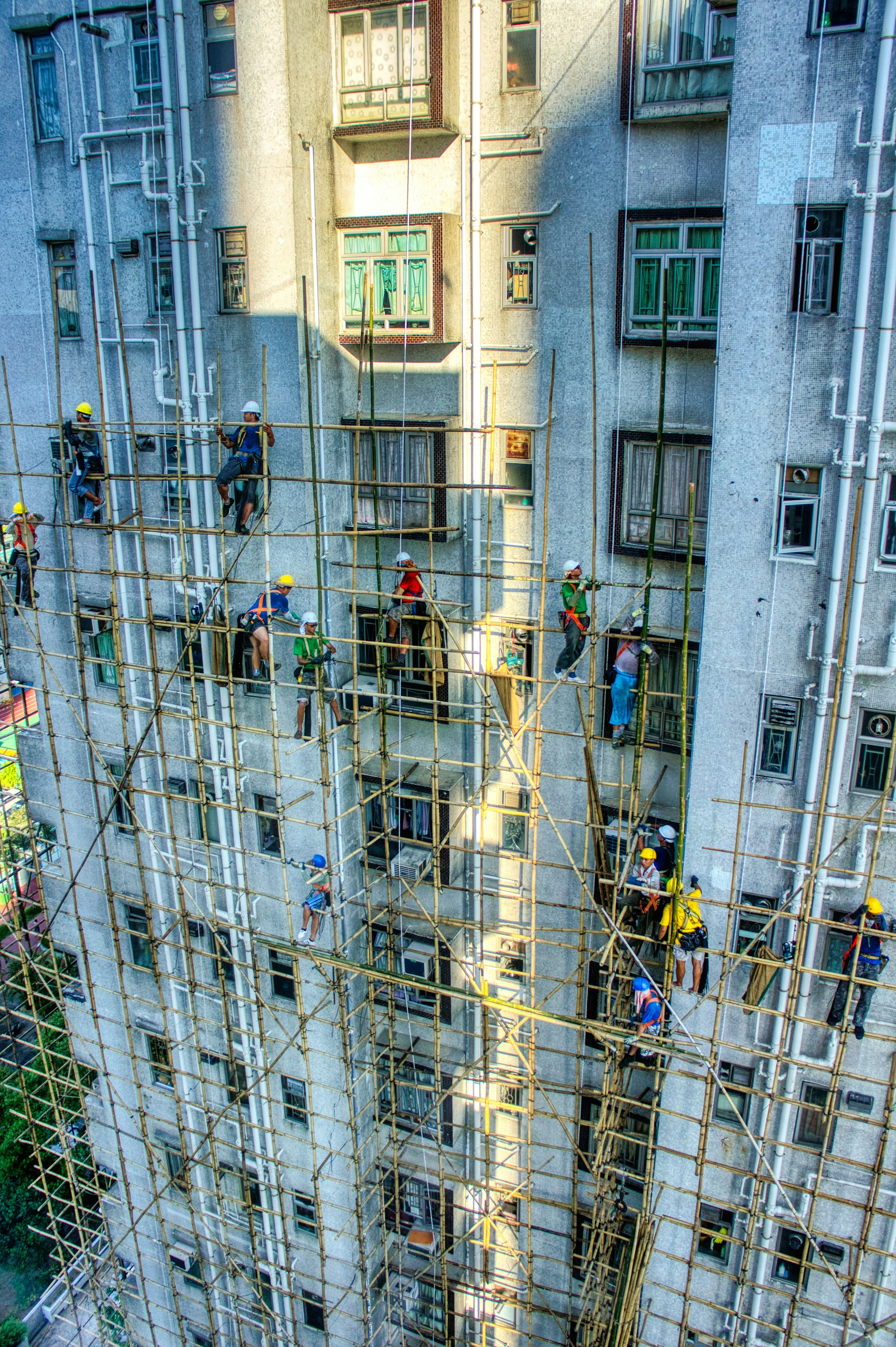 A group of people climbing up the side of a tall building