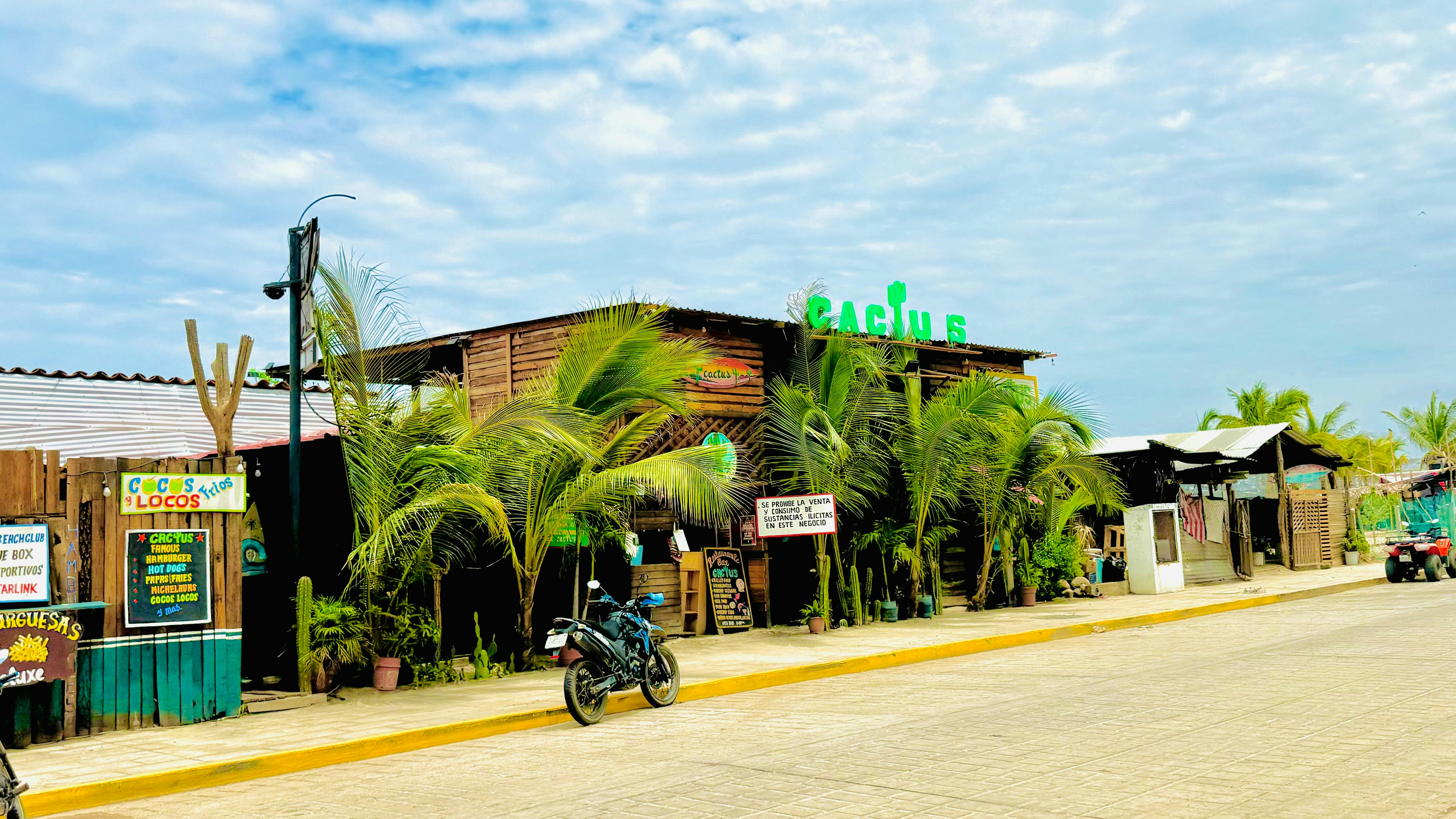 A person riding a motorcycle down a street