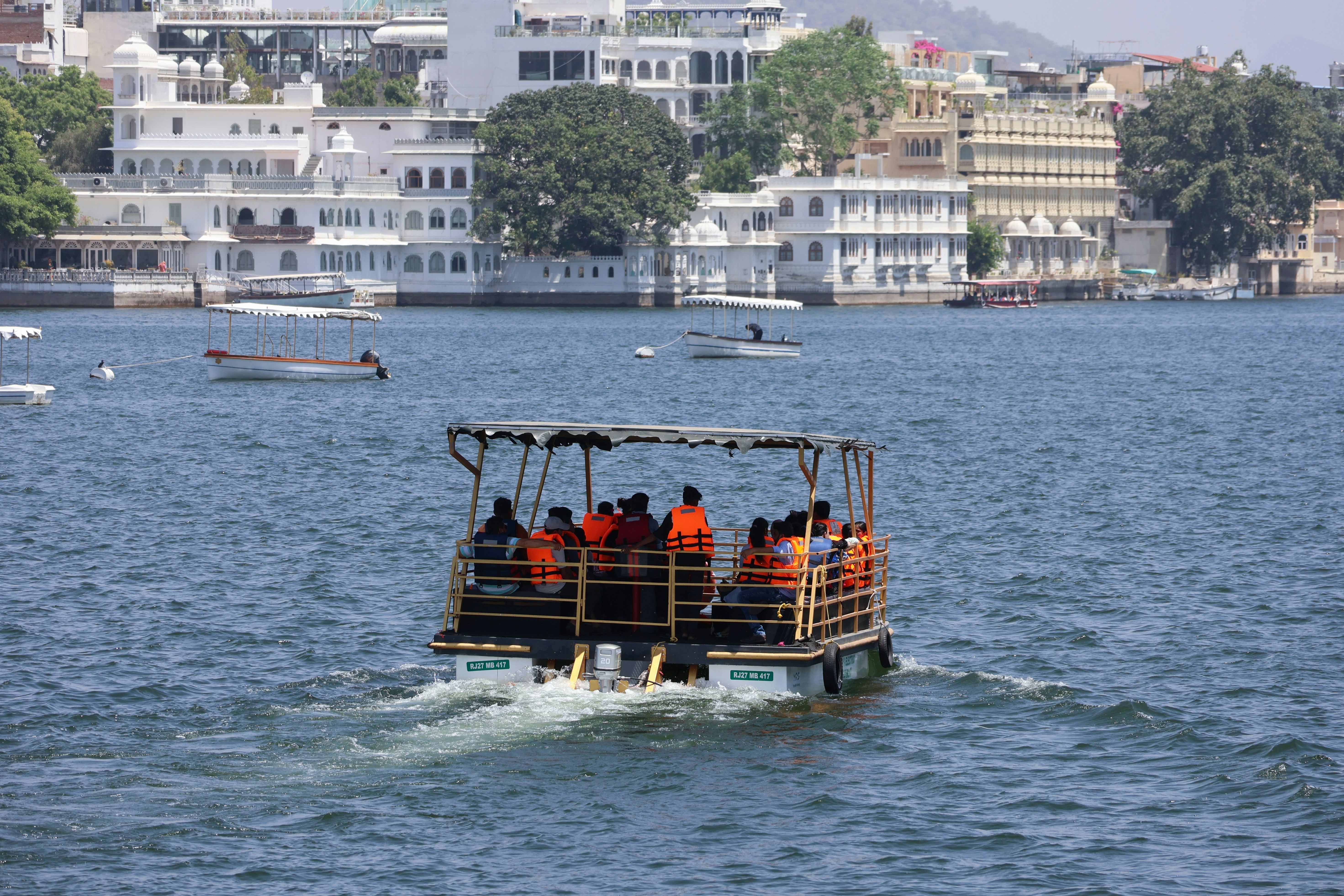 A boat filled with people on a body of water