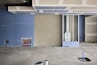 A room that has some paint on the floor