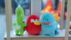 A group of stuffed animals sitting next to each other