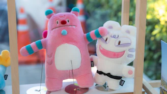 A couple of stuffed animals sitting on top of a table